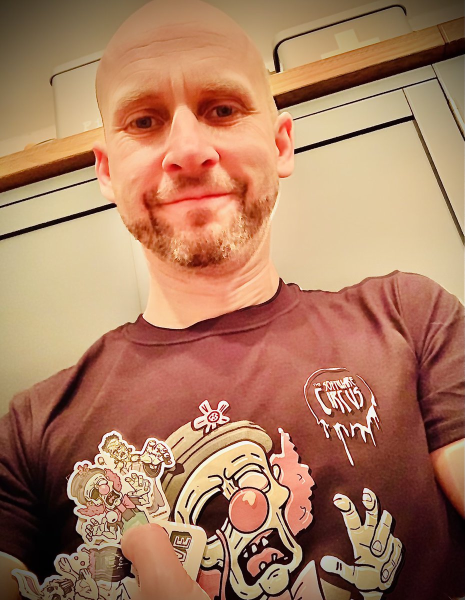 ScrumMasterUK's tweet photo. It’s Christmas jumper day...I found something much more interesting to wear! Thanks for the T-Shirt and stickers @softwarecircus and @CarlaAtGG I can’t wait for the next one. Conference was sponsored by @containersoluti https://t.co/w8vlWZKP4L