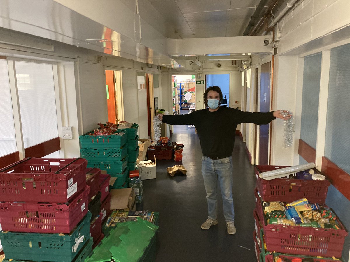 The pupils of <a href="/TCSDulwich/">The Charter School North Dulwich</a> have been having a competition to see which form can donate the most food. We declare ourselves the winners! Here’s former Charter pupil and warehouse dogsbody Jack posing with two bits of tinsel and a corridor of food. Thank you so much!