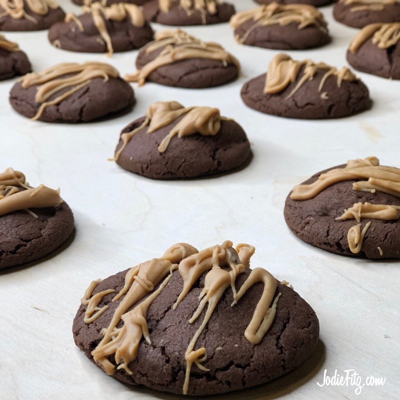 JodieFitz's tweet photo. These Reese’s stuffed cookies are our new family favorite.  The soft chocolate cookie dough wrapped around a miniature Reese’s peanut butter cup candy and then topped with drizzled, melted Reese’s Peanut Butter Baking Chips is like a trifecta of goodness.  https://t.co/E9LAgSZoJT https://t.co/MYfz0RMitP
