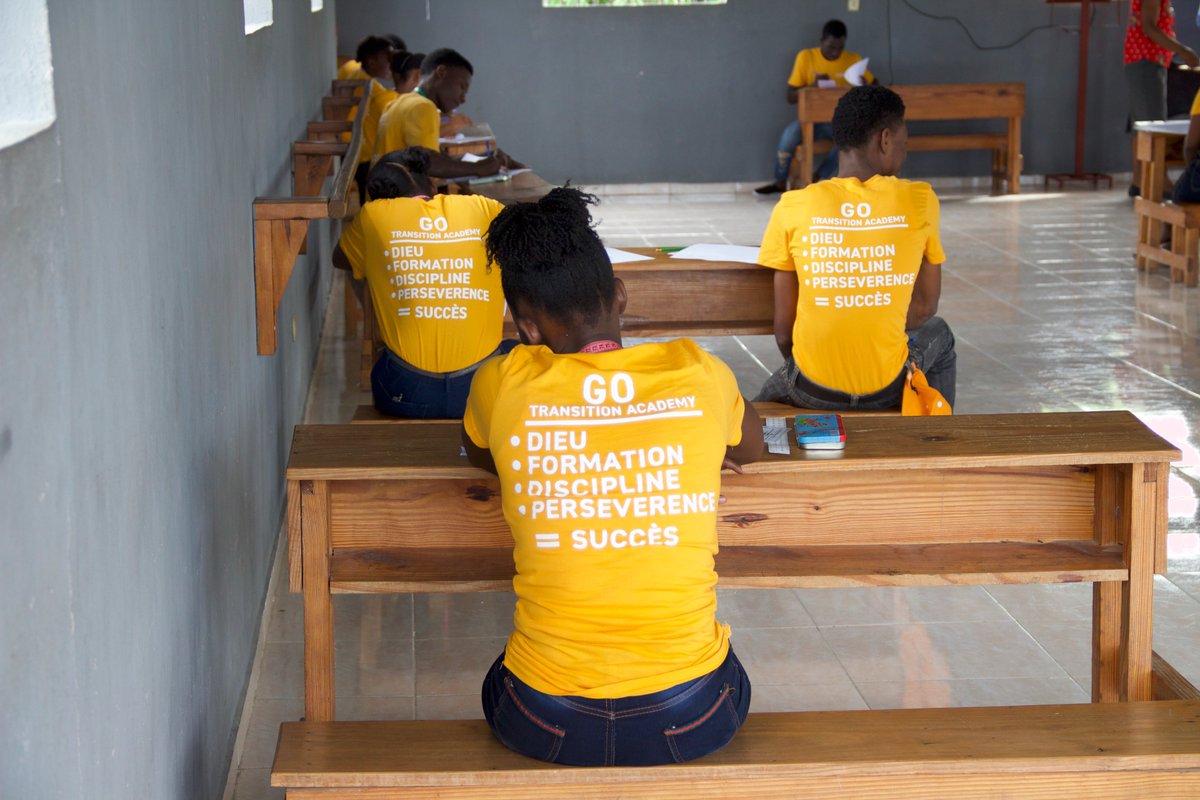 OrphanProject's tweet photo. #GOHaiti's Transition Academy students are putting their knowledge to the test before graduation! ✍��� Thanks to you, these young adults learned the #skills they need to #thrive in the real world. https://t.co/K3Jki1KJv1