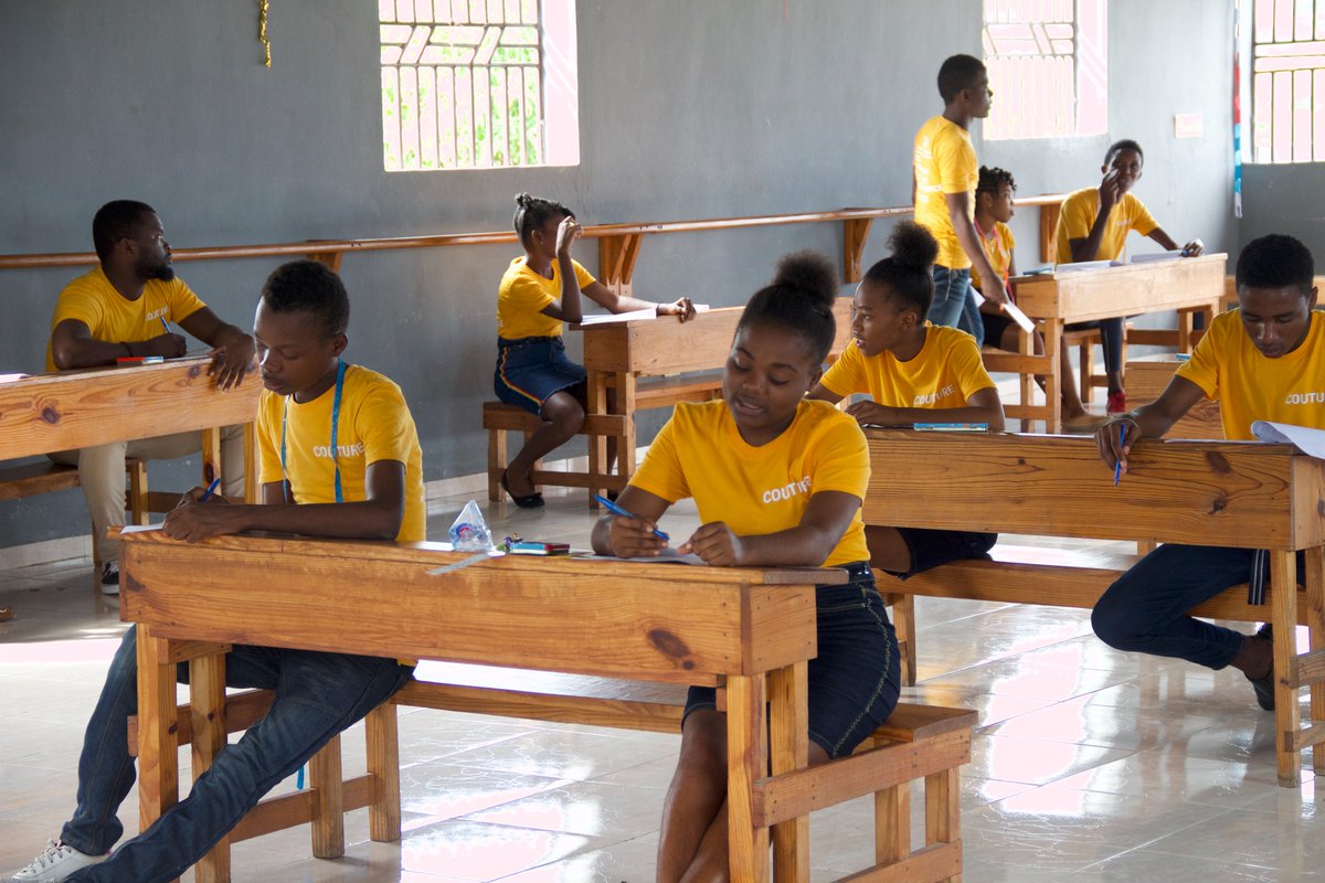OrphanProject's tweet photo. #GOHaiti's Transition Academy students are putting their knowledge to the test before graduation! ✍��� Thanks to you, these young adults learned the #skills they need to #thrive in the real world. https://t.co/K3Jki1KJv1