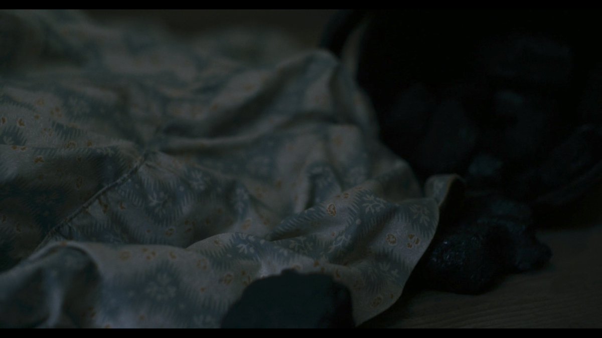  #Ammonite returns to shots of the hems of dresses & clenched hands just prior to cunnilingus between women. We saw similar images when one cried out in grief. The floral dress was once shot alone. Now, it presses against another. Transgressive sexuality is an end to solitude.