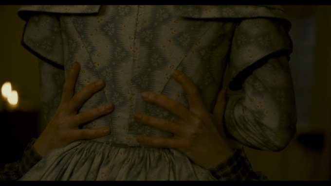  #Ammonite returns to shots of the hems of dresses & clenched hands just prior to cunnilingus between women. We saw similar images when one cried out in grief. The floral dress was once shot alone. Now, it presses against another. Transgressive sexuality is an end to solitude.