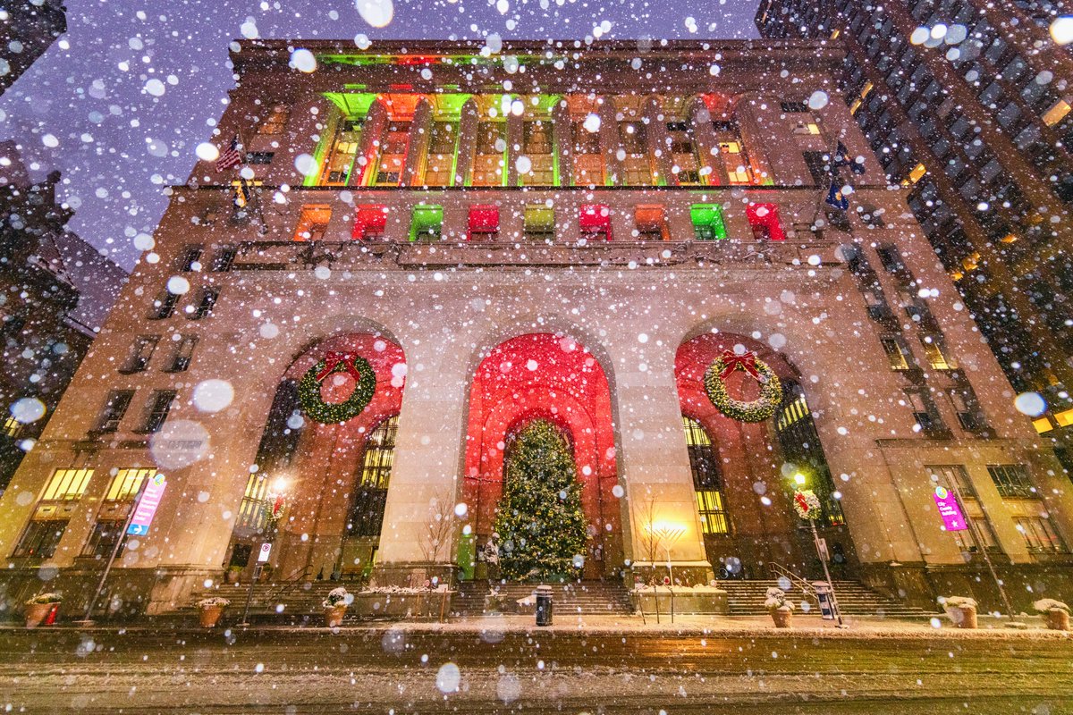DaveDiCello's tweet image. Still so many Christmas images and so little time. This is another view of the snowstorm last week in #Pittsburgh, this time featuring the City County Building. I even managed to capture the street car-free during rush hour and the building lit up with festive colors.