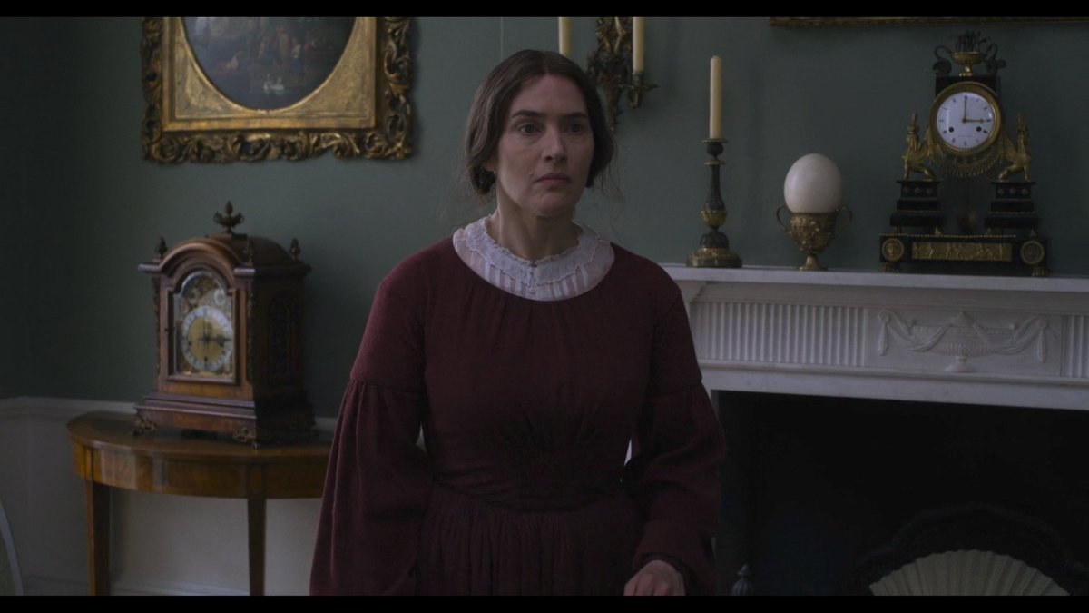 Love is tied to time in  #Ammonite. Before a young wife & lover enters her London salon, several clocks ring. It's a discordant sound.This cacophony foreshadows the alarms raised in their meeting where a scientist who walks across time will be asked to stay only in the present.