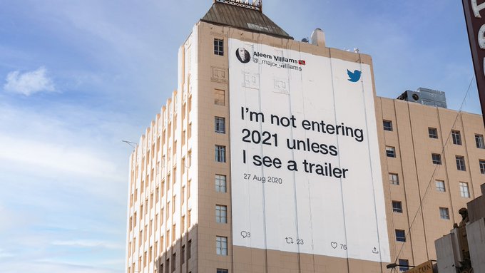 Tweet on a Los Angeles mural that reads “I’m not entering 2021 unless I see a trailer”
