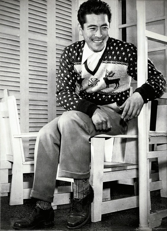 Toshiro Mifune in his Christmas sweater photographed for Eiga Star magazine, c. 1950