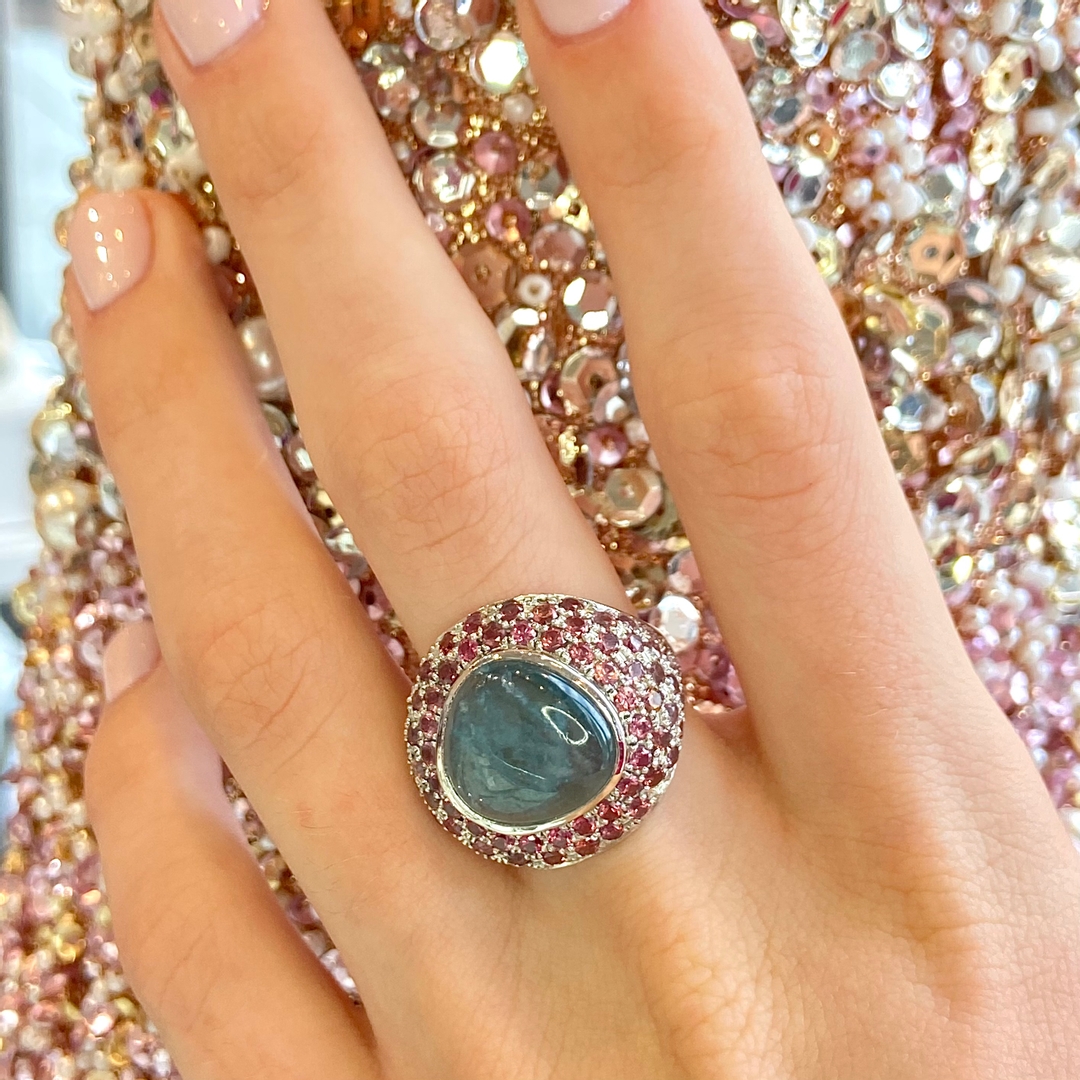NewGild's tweet photo. Meet Romeo, the fanciest ring at the party.  Lovingly crafted from platinum using lost wax casting, a glorious greenish blue tourmaline is surrounded by a pink ombré pavé of pink spinel.  The perfect Christmas gift?  Available in our gallery now. https://t.co/WTwuDEAmlF