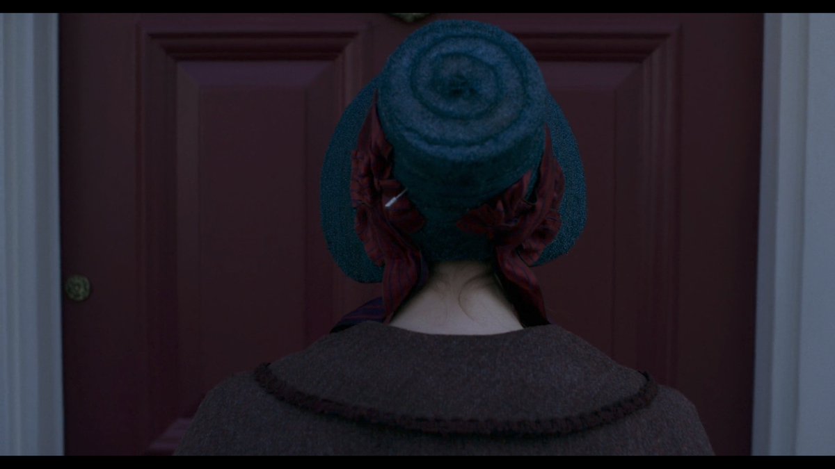 Standing at the door in London.  #Ammonite focuses on the shell-like swirl of the paleontologist's hat.Horses clamor as they did when she & her love once stood at a door together.Now she stands alone. Is the clamor a nod not to her quickened pulse but to her fear of rejection?