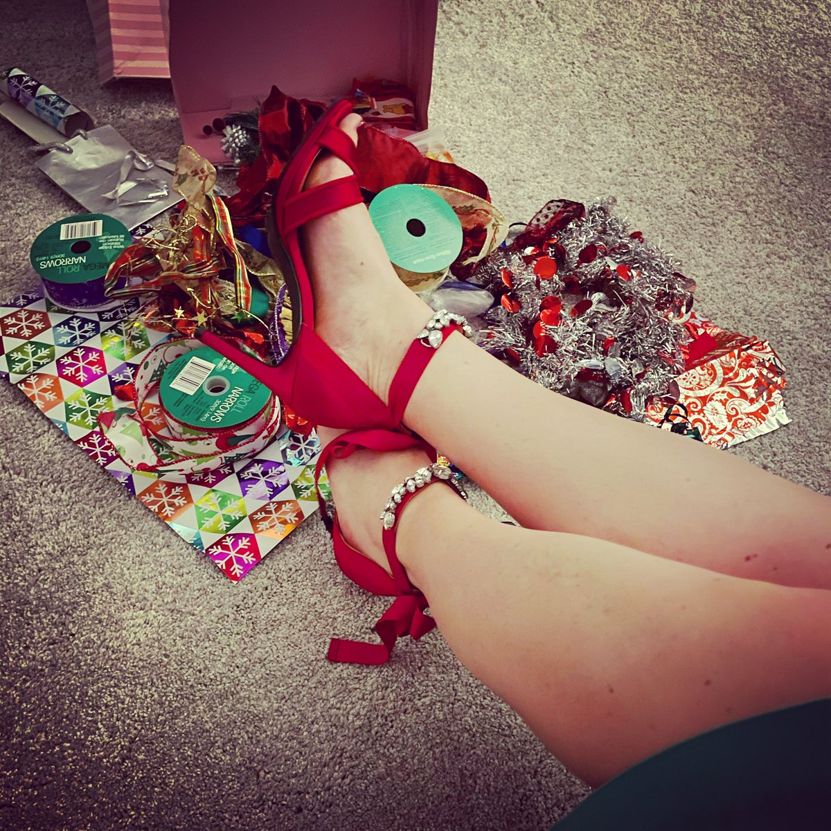 Ribbons, bows, glitter and sparkles wrapping gifts in these red wrap heels and green pencil skirt. #tistheseason #feelingfestive #wrappinggifts 🎄👠💚🎅 #redheels #shoelove365 #shoes #shoelove #sholover #heellove #heellover #highheels #heels #heelsofcourse #shoeaddict