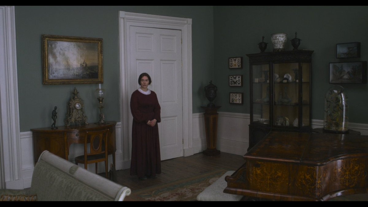 When a paleontologist from Southern England enters a London salon in  #Ammonite, a ticking clock can be heard.The city operates on the clock. It is beholden to time in a way antithetical to a scientist whose work allows her to take eons-long steps into the past.