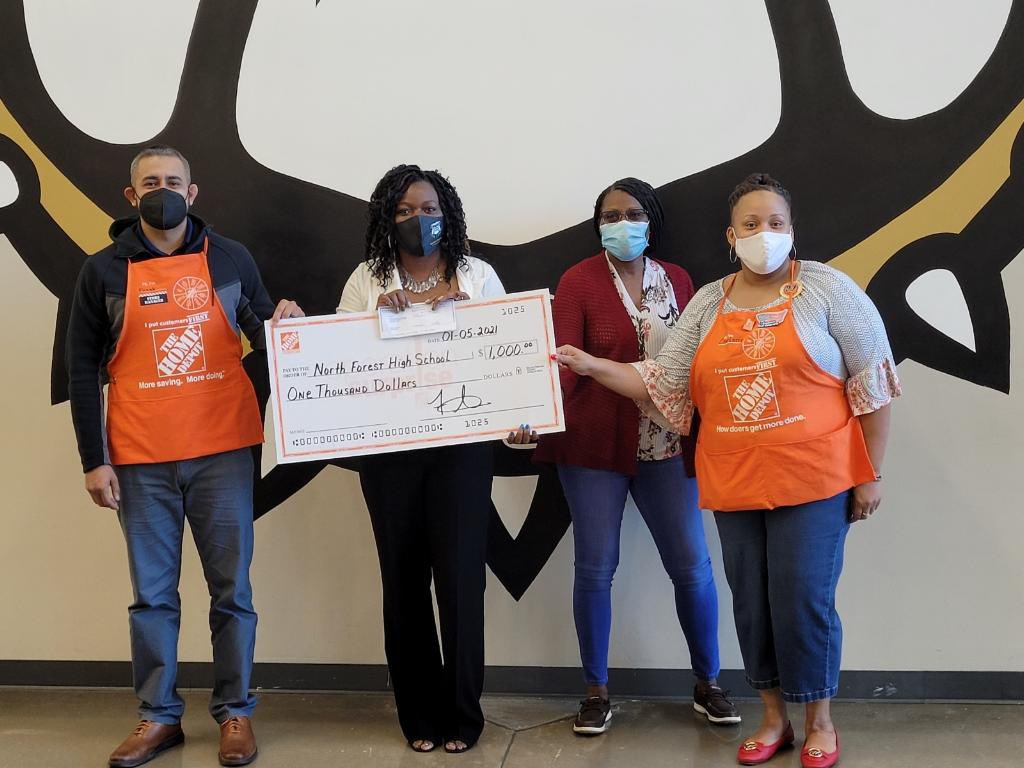 Home Depot Operation Surprise present a thousand dollars check to North Forest High School.   Giving back to our community.  Store Manager Frank Salinas,  OPASM Yolanda Mosley and ASDS Charlotte  French present to Principal, Connie Smith.  <a href="/dontamcam/">Tammy Campbell</a> <a href="/bliczwek/">Brian Liczwek</a>