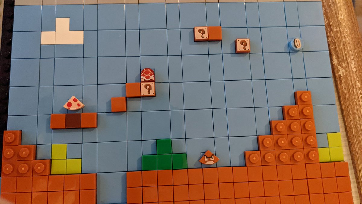 Now that I have that built, it's time to build the Mario scene, and that is being built pixel by pixel by pixel...Painstaking but satisfying!Look at the little painted bricks! The coin  Fiddly but adorable.
