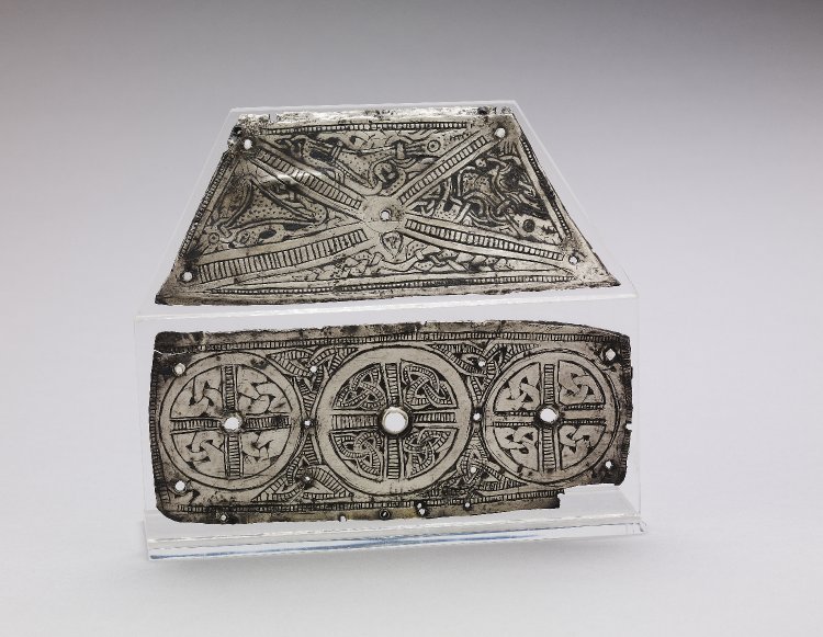 Two silver plates from a house-shaped casket shrine of the early 10th century; the decoration features Trewhiddle-style elements with double-contoured, degenerate animals that belong to an English variant of the Viking Jellinge style:  https://www.britishmuseum.org/collection/object/H_1954-1201-1