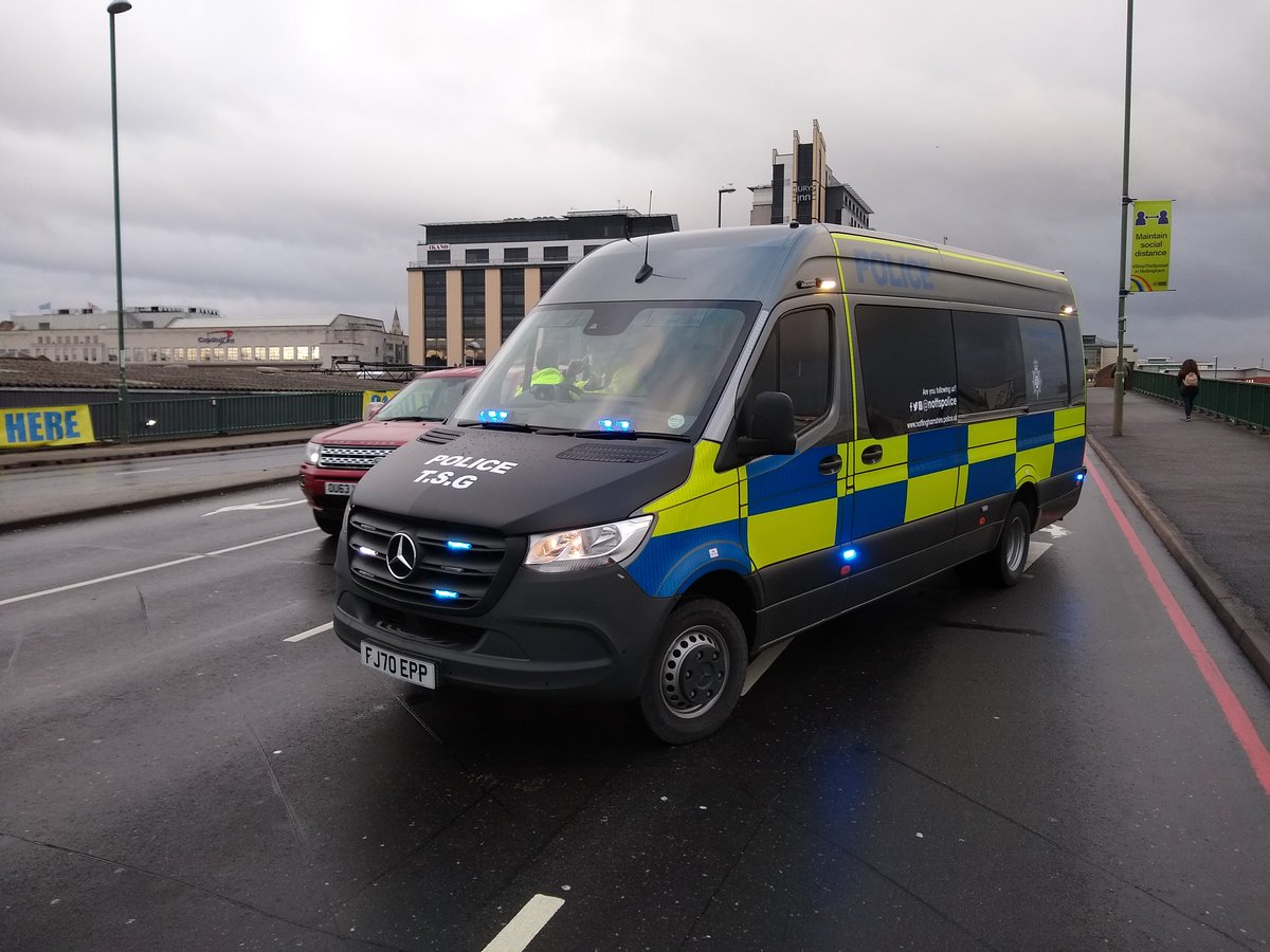 Police are here, bringing up the back of the march and blocking the road ahead. I think it is to control traffic but hard to tell because...