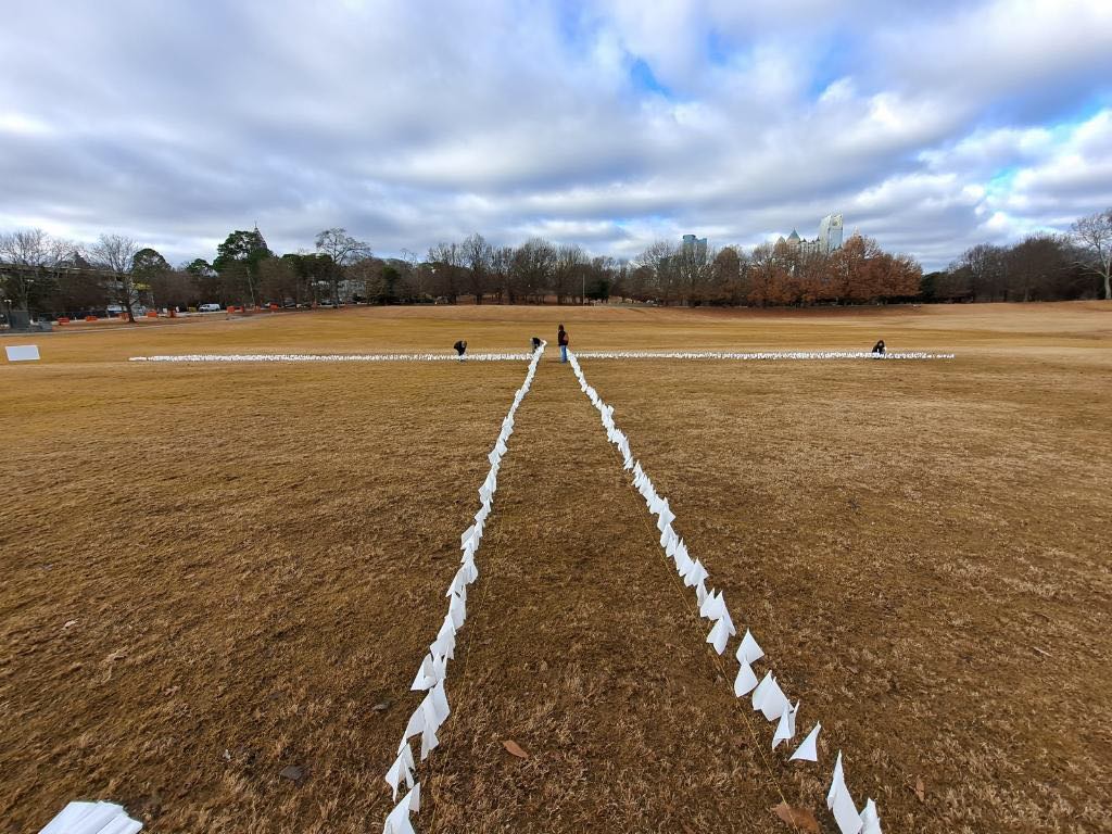 CareTestProtect's tweet photo. HAPPENING NOW IN ATLANTA'S PIEDMONT PARK: Days before the Senate runoff, local activists & COVID-19 survivors are planting 10,000 white flags to honor the Georgian's we've lost to COVID-19. Join us: https://t.co/sE7BWqDrOV #WhiteFlagsforGeorgia #GeorgiaRising #WhatWeNeed #PPENow https://t.co/x9Bt5DVVjy