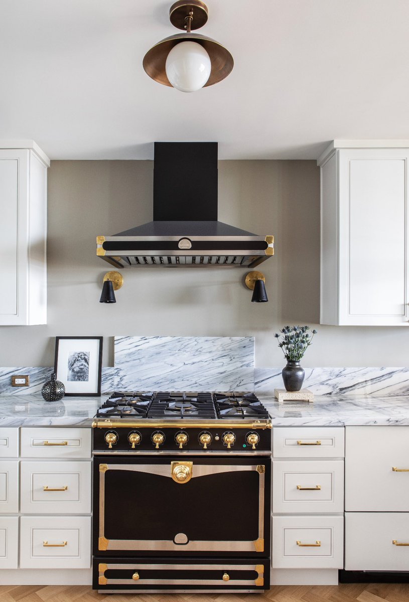 For this #NateBerkusAssociates project, we paired a gorgeous black and gold @LaCornue stove with shaker style cabinetry and gold accents. The result is a kitchen with a chic French countryside vibe that you don’t usually see in a condo. Featured in @Tatlermagazine.