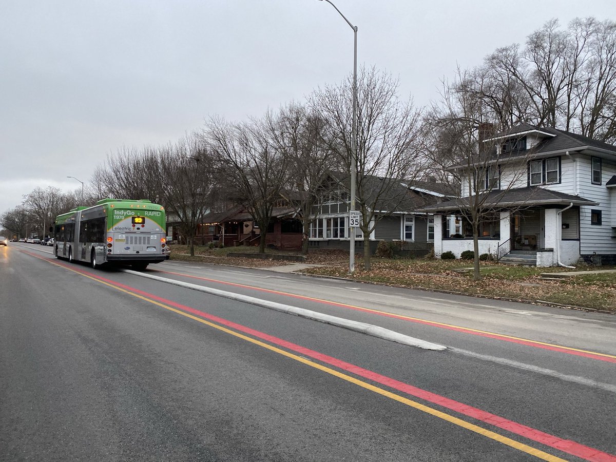 In one narrow stretch it uses a two-way center lanes with buses passing at stations. This is in a residential neighborhood — the kind of place where NIMBYs often kill transit lanes.