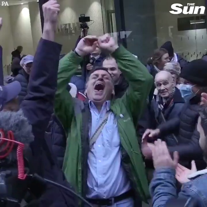 Julian Assange supporters celebrate outside court after judge denies his extradition to the US