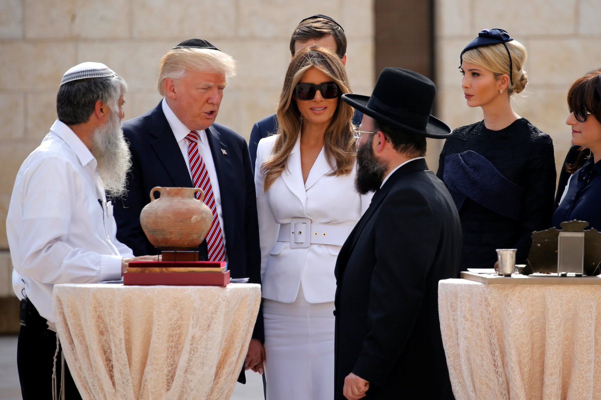 He was asked to look at ancient text explaining the importance of the wall,Men and women are separated in front of the wall but DJT is stood with Melanie which displays power,He is not a puppet for Zionist, they do not exist, there is just Venetians and the 13 blood line families