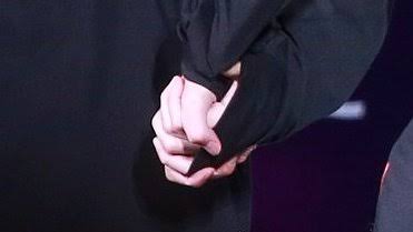 intertwining their hands
