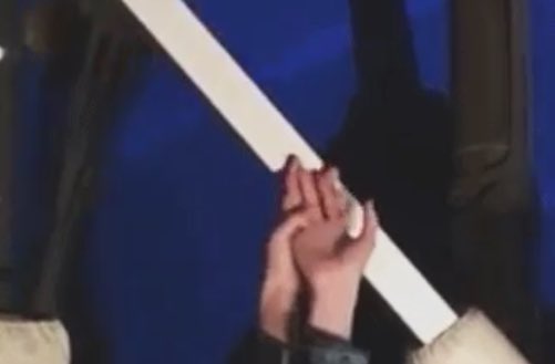 intertwining their hands