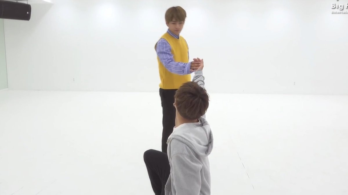 intertwining their hands