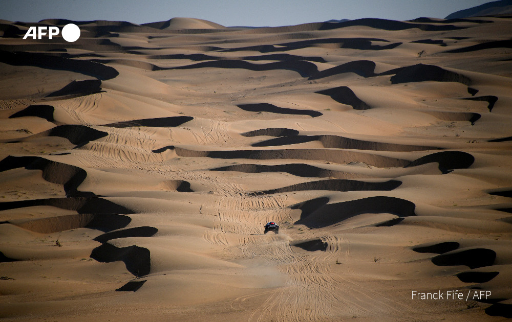 Sand and time.

<a href="/AFP/">AFP News Agency</a> photographer Franck Fife covers Stage 2 of the Dakar Rally 2021 between Bisha and Wadi Ad-Dawasir in Saudi Arabia