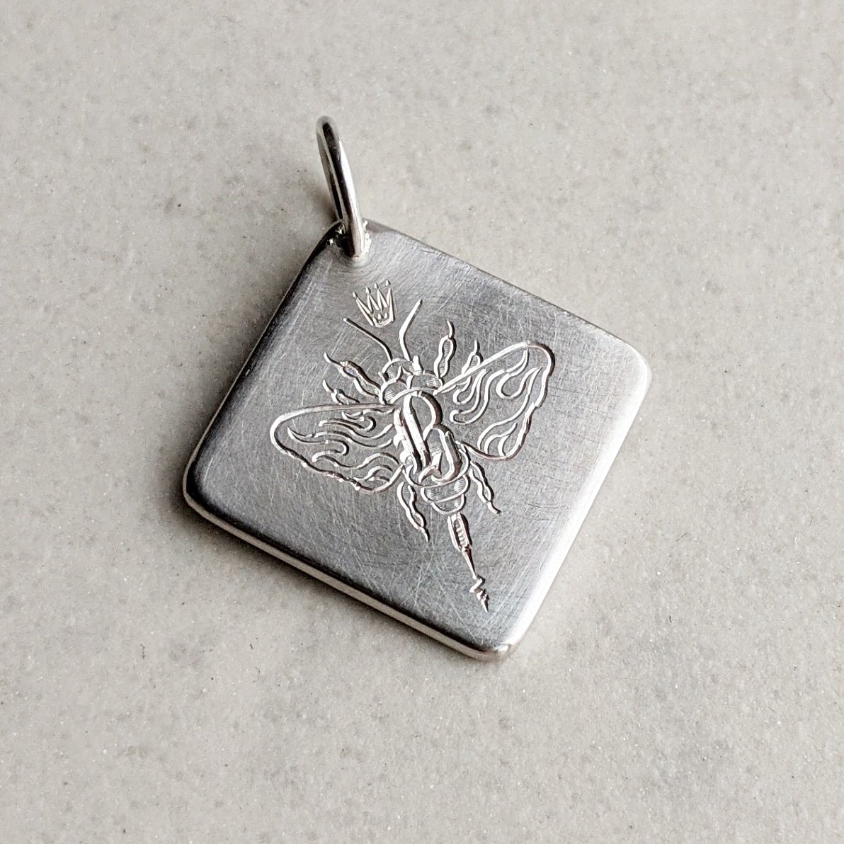 Bee pendant...hand engraved on satin silver. Not quite the return to work & school we planned...let the juggle continue! @rosalynemporium #tuesdayvibe #beependant #lockdown #juggle