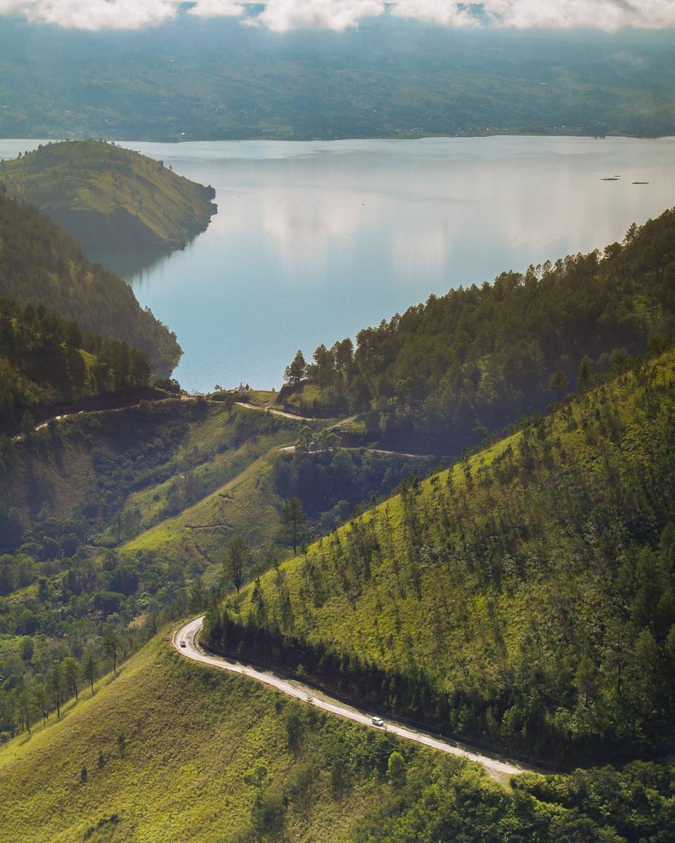Here's a blissful scenery of Samosir Island, North Sumatra to brighten your day! Situated in the crater of Lake Toba, this gorgeous shot proves how magical the landscape looks from the sky!
📸: <a href="/Wiraseto/">WIRASETO DODDY</a> 

#FromIndonesiawithLove 
#WonderfulIndonesia