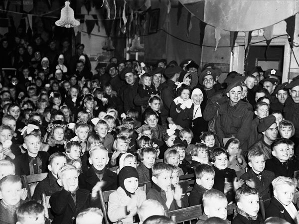 Children attending a Christmas party sponsored by the Argyll and Sutherland Highlanders of Canada, Elshout, Netherlands, December 1944.