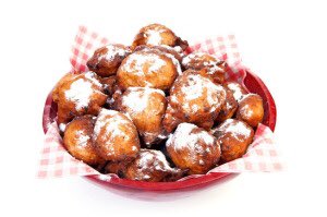 These are “oliebollen” (oily balls), which are only eaten on New Year’s Eve when alcohol abuse has ensured that the Dutch have lost the last remnants of decorum and good taste. The balls are made by dropping a box into the canal and then mushing the wet cardboard up into balls...