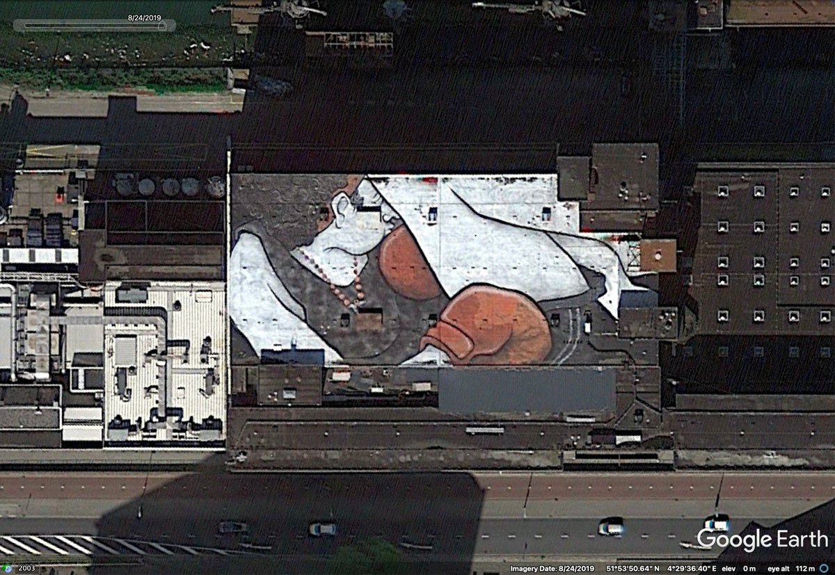 10 is the "Sleeping Rosa" watching over the water in Rotterdam here:  https://goo.gl/maps/CXchpRWS41TfynmYA. Here's an aerial shot with a little more colour:  https://www.instagram.com/p/Bynb1BhpOX-/ .