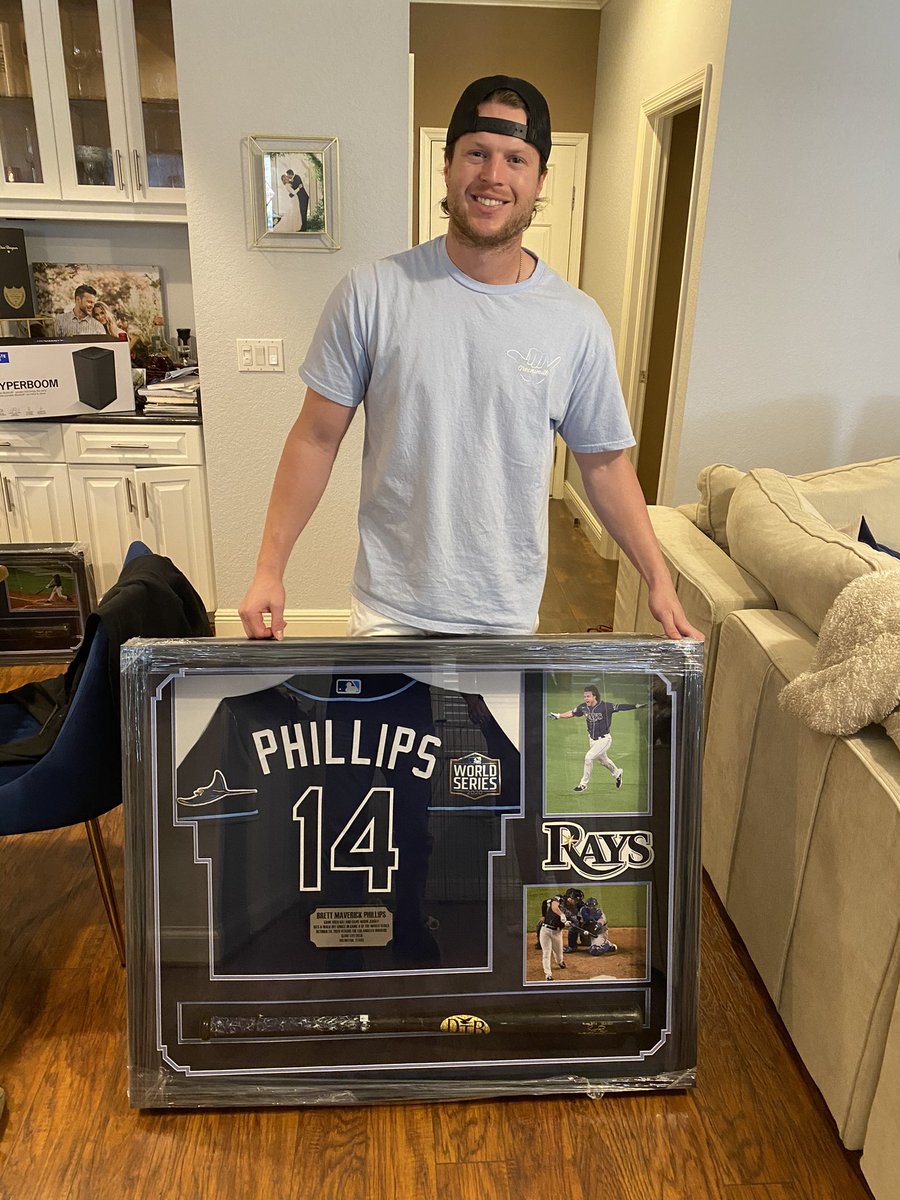 Brett_Phillips8's tweet photo. If only this little @RaysBaseball fan on the left knew he’d be playing for his hometown team 22 years later in the World Series... Your dreams are achievable, let me be the first to encourage you! Merry Christmas and Happy Holidays! https://t.co/PMZPLzF8bz