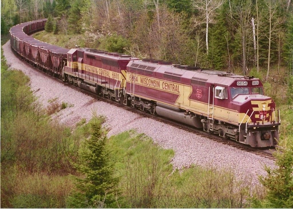 The sharp-eyed among you may notice in the quote-tweeted photo that the hoppers behind the loco are not your iron ore hoppers (see image). They are, instead, coal hoppers! There's a fantastic story behind this apparent inefficiency:  https://twitter.com/BlessedTrains/status/1342196823692353541