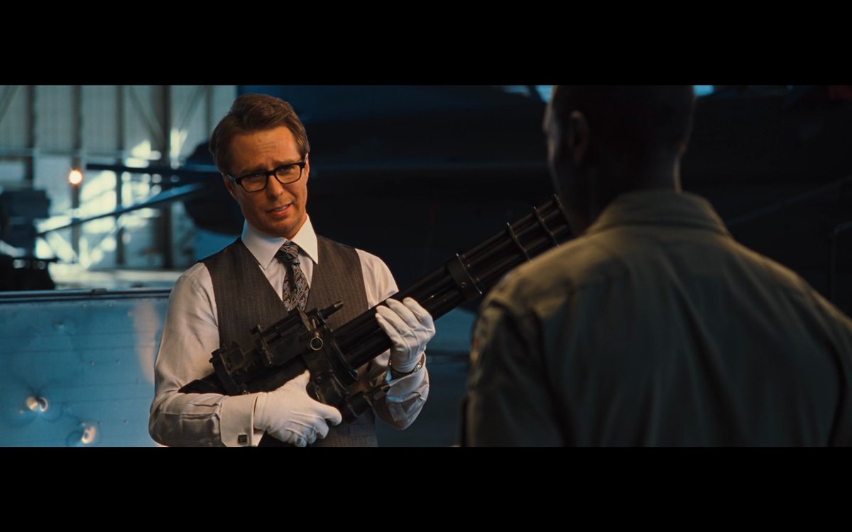 Iron Man 2 spotlights the MCU’s love affair with guns and gun culture. Odd for a franchise that A) is about superpowers and B) started with tacit criticism of weapons manufacturing. Even when bad guy Justin Hammer is showcasing an arsenal for War Machine, guns are framed as cool.