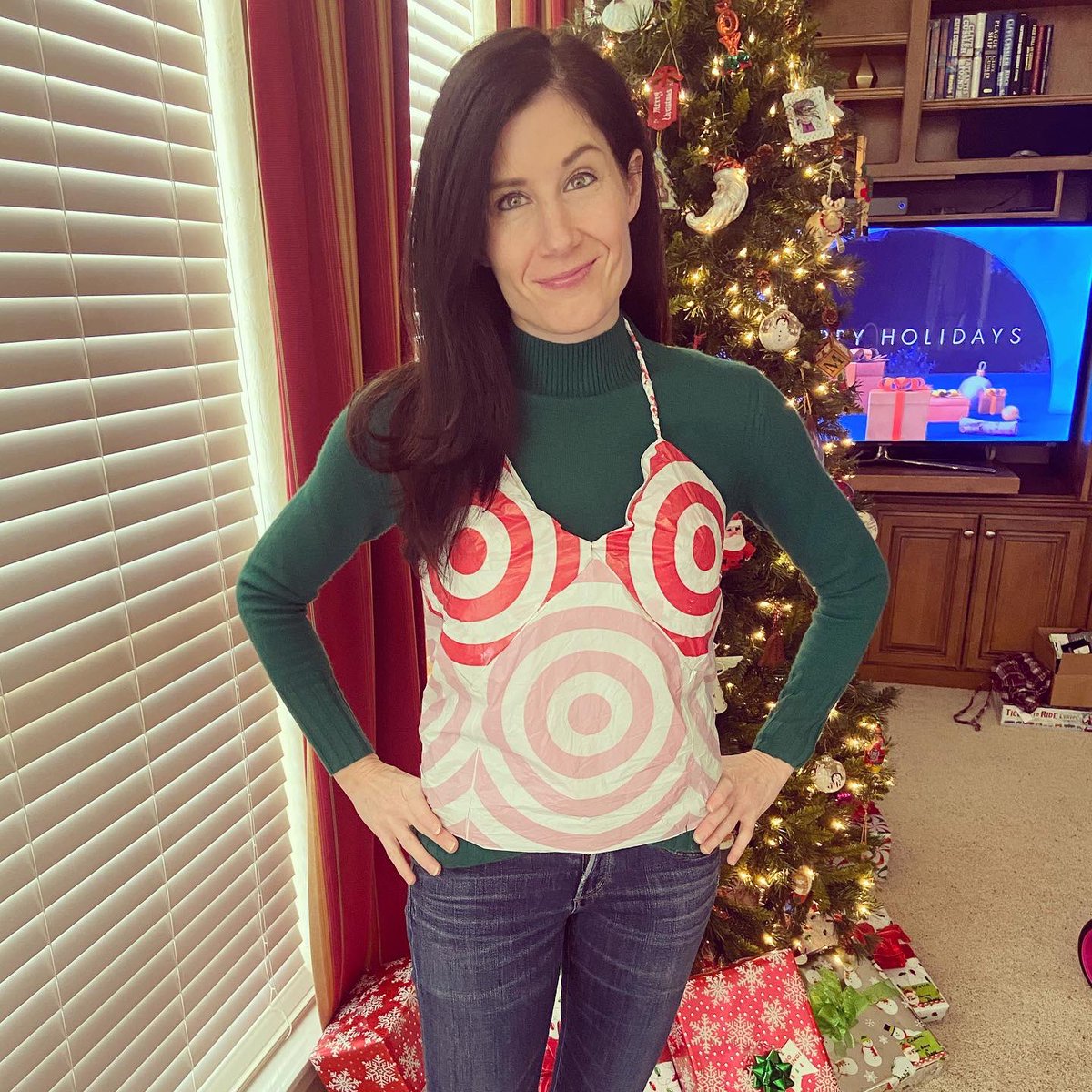 NathanSmithson1's tweet photo. Hey @Target! It’s my annual “gift” to my wife of clothing made out of Target bags. What do you think of the halter top? Also, you saved our bacon when we forgot to pack some Santa gifts! https://t.co/xmQ0946BDQ