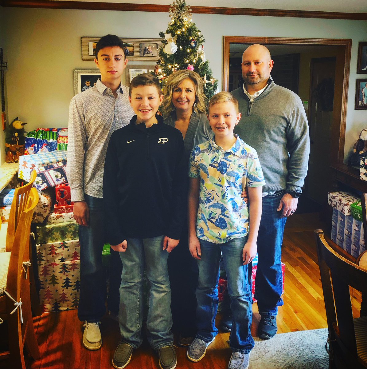 CRBrubaker's tweet photo. Merry Christmas tweeps. You don’t need many presents when you have these 4 to stand with. Especially the babe in the middle. #crb5 https://t.co/PSX3aD5kue