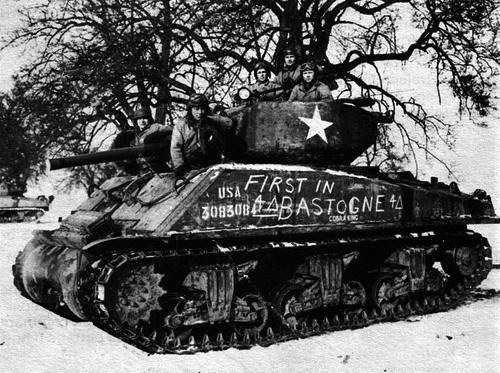 [8 of 12]Today, Cobra King, a Sherman tank manned by the battalion's Company C, became legendary. The tank, forever known as "The First in Bastogne," led a column of infantry and armor into the city.