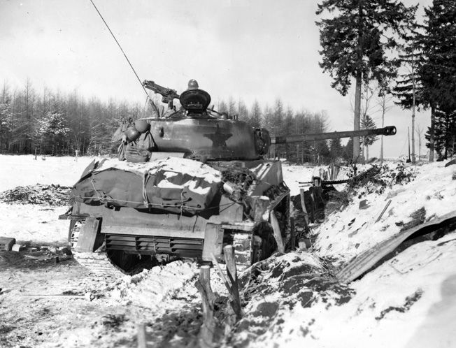 [7 of 12]But now they were approaching Bastogne. Abrams' tankers were ready for a head-to-head fight with the Panzer forces. Abrams was to relieve the 101st but had made slow progress getting his tanks there over the previous 5 days (ice, enemy fire, bad roads).