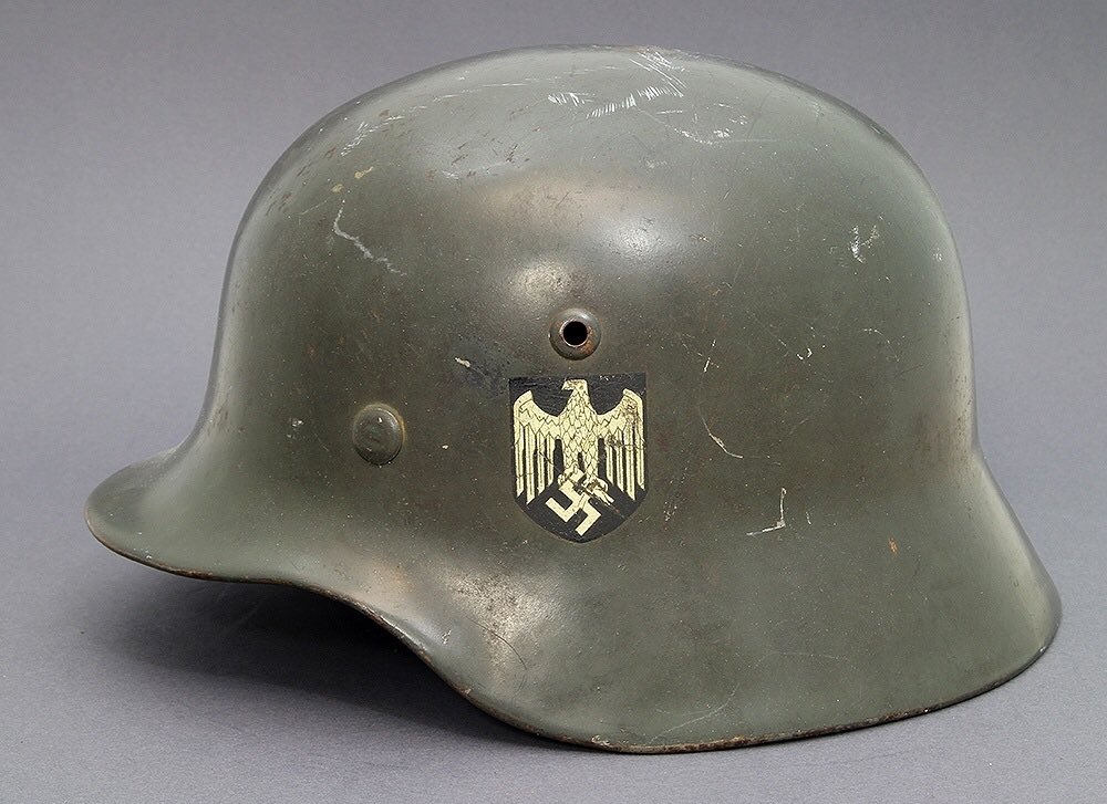 The M35 was characterised by a smooth, matte grey paint finish, separate piece ventilation holes above the decals & 3 rivet pins (front right, left & rear) to secure the M31 liner. Key was the addition of the Arm of Service decal on the left of the Stahlhelm. 4)