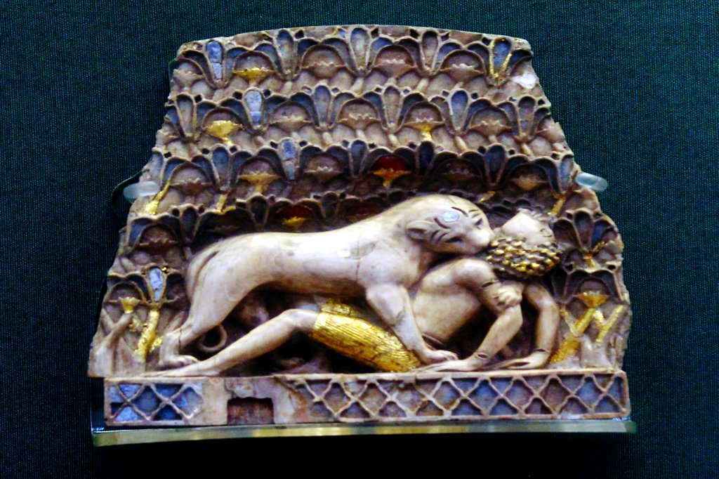 Thread: Inlaid ivory panel depicting "lioness devouring a boy"... From the palace of Ashurnasirpal II, part of an almost identical pair, originally part of a piece of furniture, perhaps a throne. ca 899-700 BC...