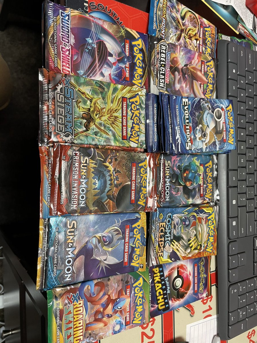 RogueGames1's tweet photo. We got some old booster packs in stock today! We finally also have Rage of Ra and one more Champions Path ETB! @Pokemon  @YuGiOh_TCG  @flgs https://t.co/41F9sUINqa