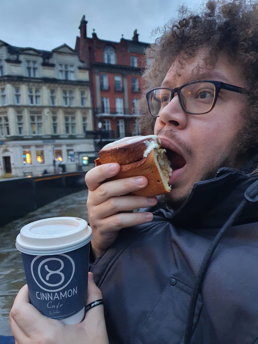 Just me living my best life with a cinnamon roll too big for my face 🙃