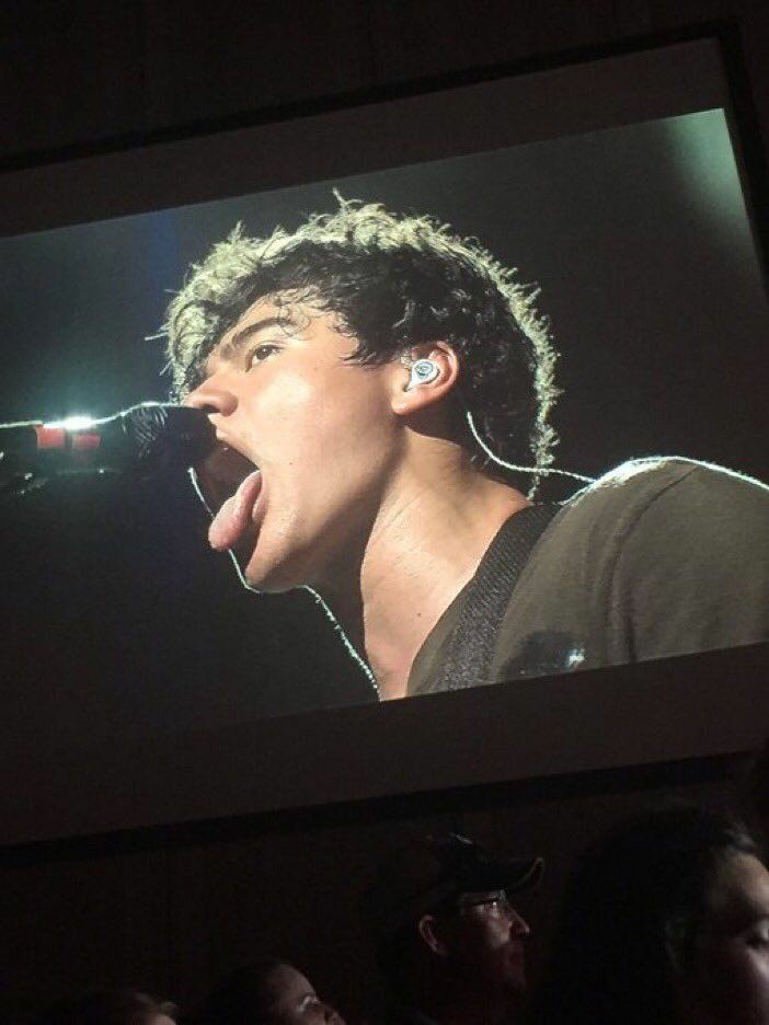 a thread of calum with his tongue out