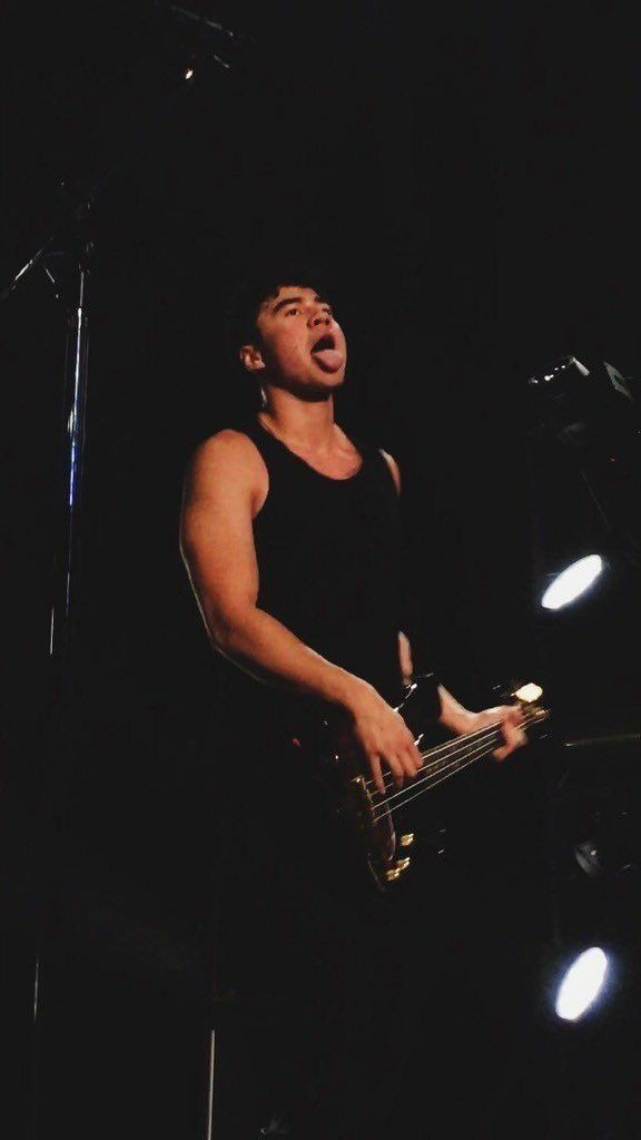 a thread of calum with his tongue out