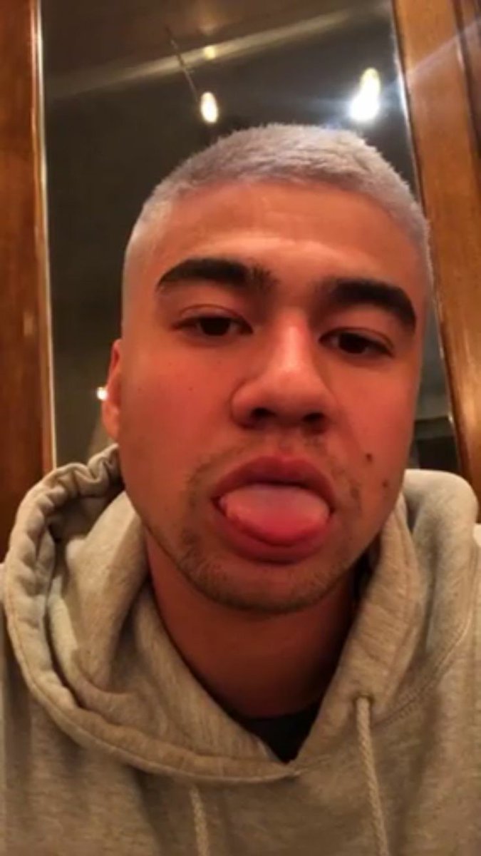 a thread of calum with his tongue out