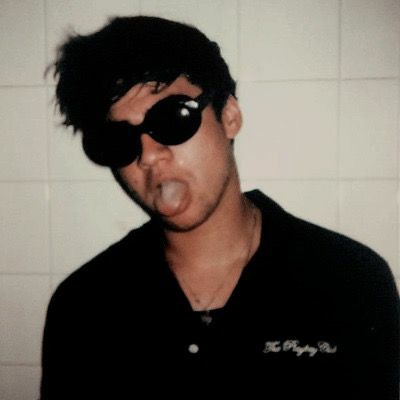 a thread of calum with his tongue out