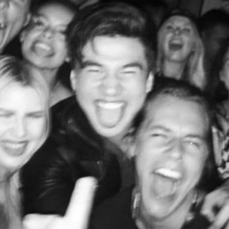 a thread of calum with his tongue out