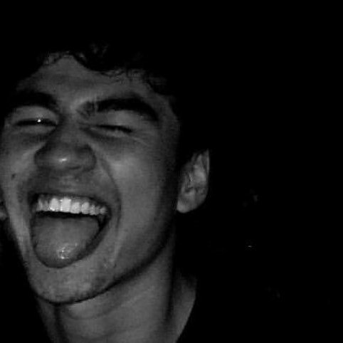 a thread of calum with his tongue out